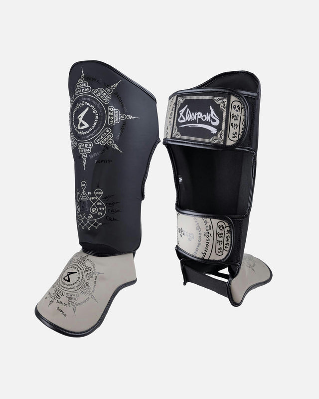 8 WEAPONS Shin guards 8 Ways Yant – Black/Sand