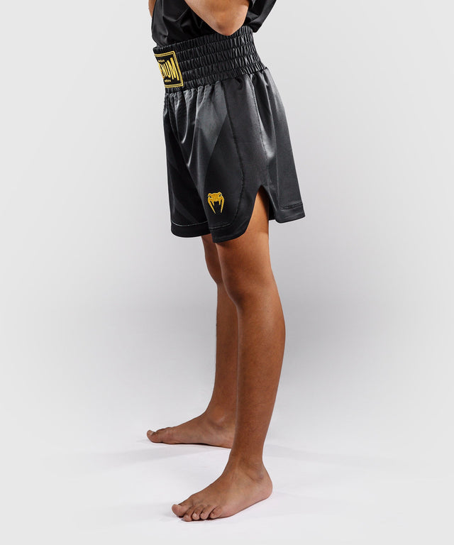 Calções de boxe Venum Attack – Preto/Ouro – Criança
