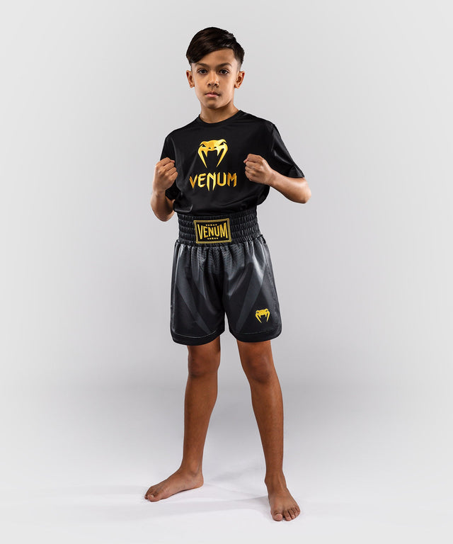 Calções de boxe Venum Attack – Preto/Ouro – Criança